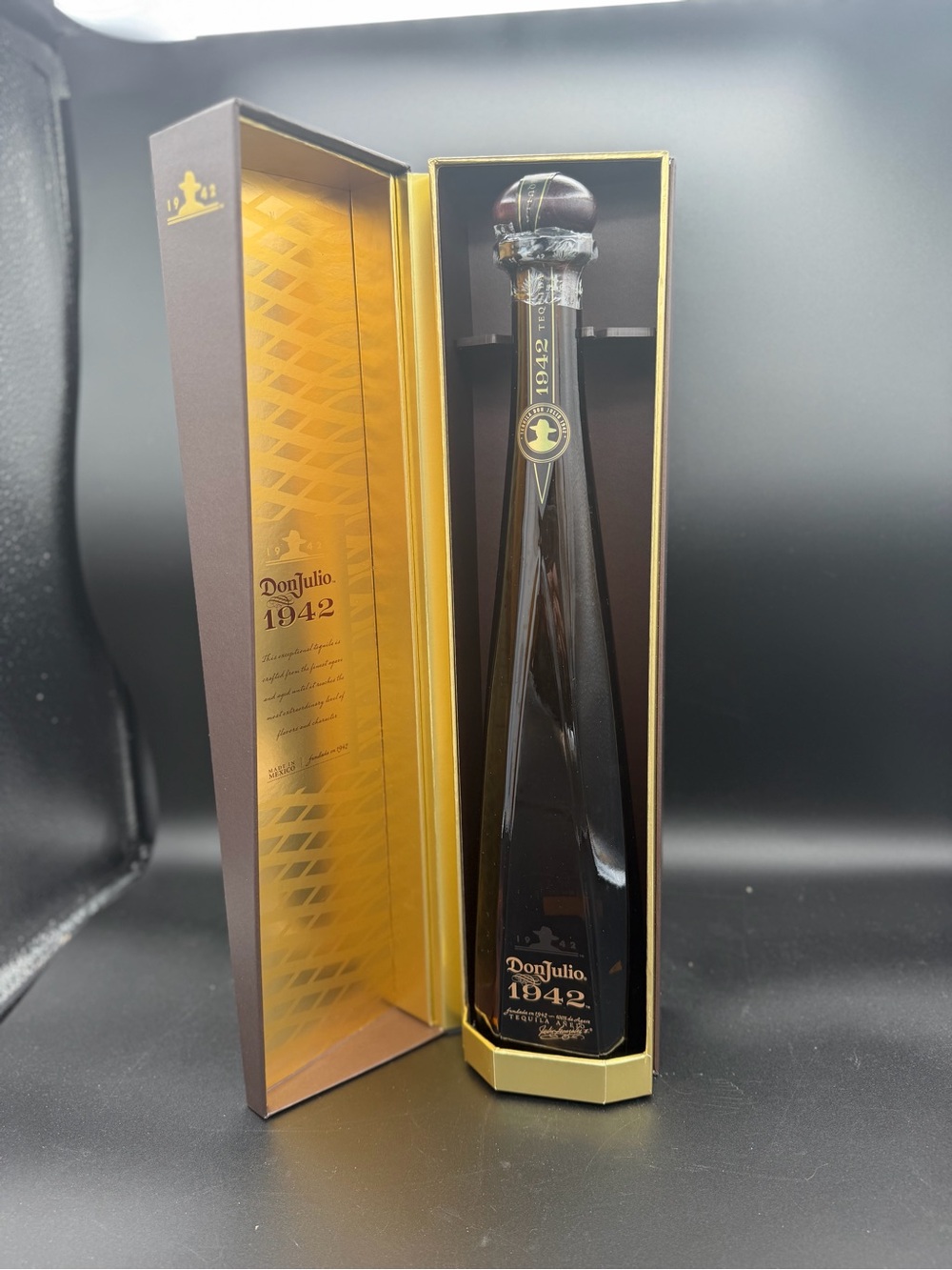 Don Julio 1942 empty bottle with box very, neck clip in box not completely there